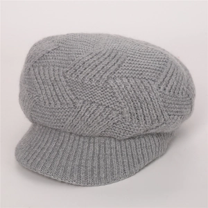 Close-up of grey twill knit newsboy cap showing fuzzy mohair texture and ribbed brim detail