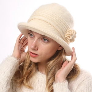 Beige winter cloche hat for women with knit flower detail and warm ribbed texture