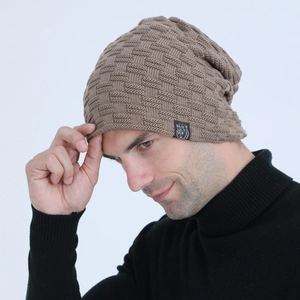 Detail view of men's brown knit beanie with checkered texture and bear patch