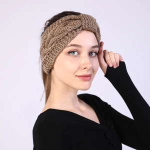 Detail of camel chunky knit headband featuring a thick twist knot and warm ribbed texture