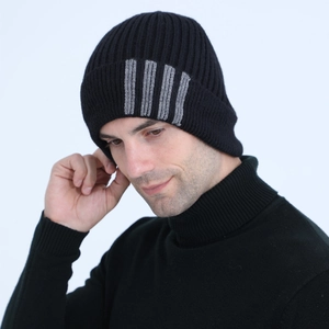 Detail of black ribbed knit beanie featuring signature grey four-stripe pattern for men