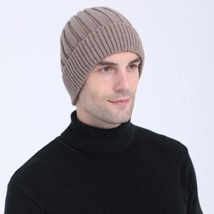 Detail of coffee brown ribbed knit beanie hat showing thick texture and warm fleece lining