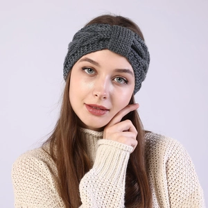 Detailed knit texture of a grey twist headband showing warm chunky wool yarn pattern