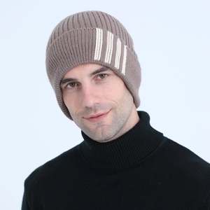 Close-up of men's taupe knitted beanie with white stripes and ribbed texture