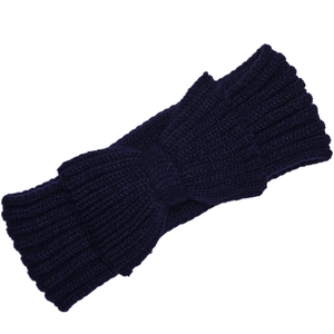 Detailed view of dark blue chunky knit bow headband with vertical ribbed texture