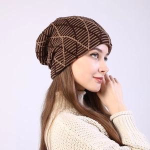 Detail of winter knit beanie with brown geometric diamond pattern and warm texture