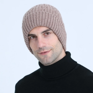Close-up of light brown ribbed knit beanie with turn-up cuff on a male model