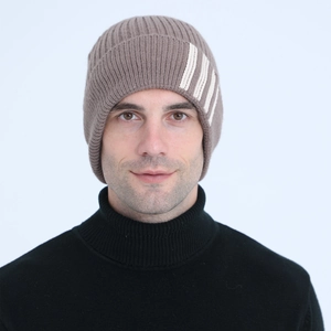 Close-up of dark brown knit beanie featuring thick fleece lining and white stripes