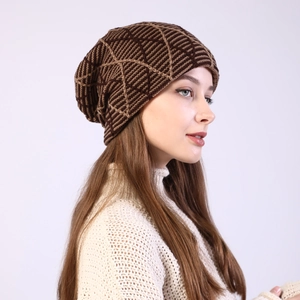 Detail of brown geometric knit beanie showing soft wool texture and loose slouchy fit