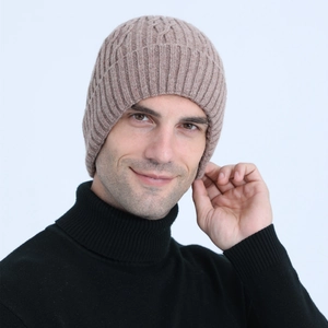 Close-up of cable knit beanie texture with fleece lining and soft wool blend material