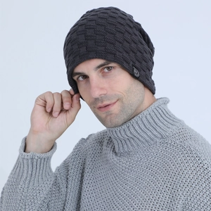Detail view of dark grey knit beanie featuring premium textured checker pattern weave