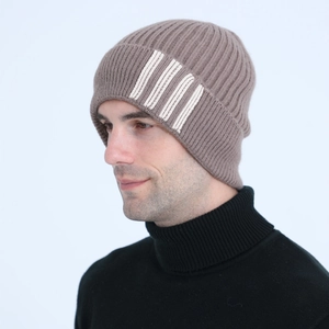 Detail of coffee brown ribbed knit beanie with four vertical stripes on the side