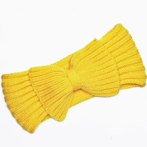 Detail of a bright yellow knitted headband featuring a 3D bow design and ribbed texture