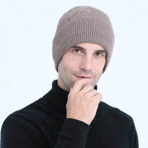 Detail of cable knit pattern and ribbed texture on brown men's thermal beanie hat