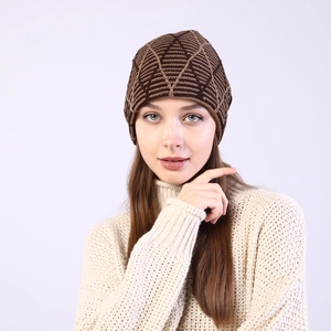 Detailed view of winter beanie with geometric knit pattern and warm fleece lining