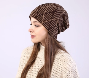 Close-up of geometric knit pattern on warm winter beanie with thick textured yarn