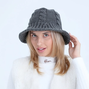 Detailed knit texture and ribbed brim of a dark grey wool bucket hat for women