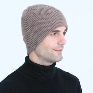 Detail view of brown cable knit beanie with fleece lining and thermal ear protection
