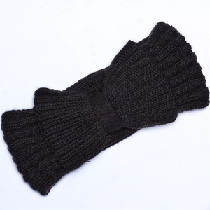 Close-up of a dark coffee knitted headband featuring a warm bow design and ribbed texture