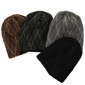 Detailed view of jacquard knitted beanies with diamond patterns in multiple colors
