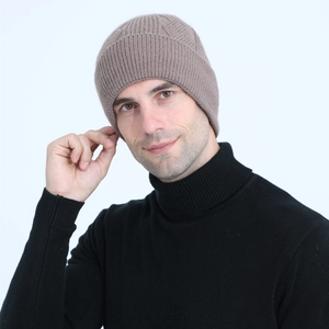 Close-up of men's cable knit beanie in coffee brown with geometric ribbing detail