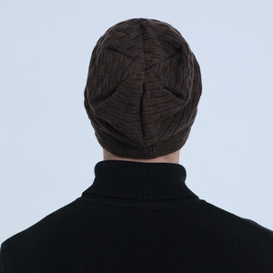 Rear view detail of dark brown waffle knit beanie showing thick texture and fit