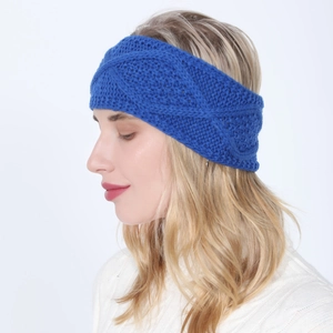 Detail of blue chunky knit headband for women featuring classic twist knot design texture