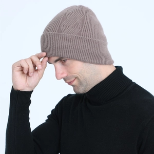 Close-up of men's dark brown cable knit beanie with warm ribbed texture and diamond pattern