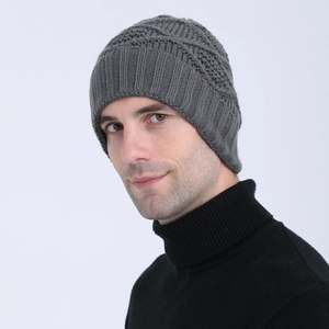 Close-up of dark grey knitted beanie showing thick textured ribbing for winter warmth