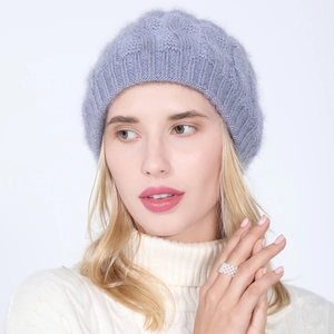 Close-up of lavender knit beret showing soft fuzzy texture and subtle silver sparkle