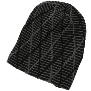 Detailed close-up of knit winter beanie with black and grey geometric textured pattern