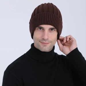 Detail of dark brown ribbed knit beanie showing textured wool fabric and elastic pattern