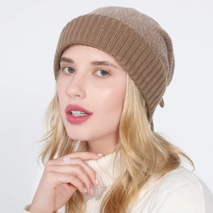 Detail view of khaki knit beanie featuring soft ribbed texture and premium warmth