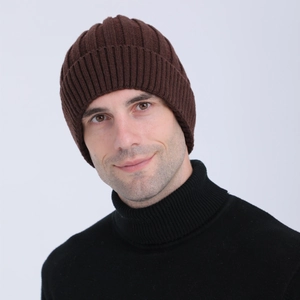 Detailed close-up of dark brown ribbed knit beanie with thick wool blend texture