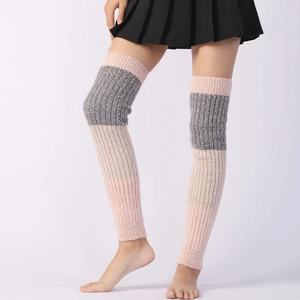 Detail of tricolor cable-knit leg warmers in pink grey and beige over-the-knee style