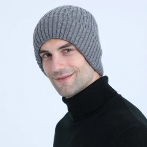 Detailed close-up of men's gray cable knit beanie with warm fleece lining for winter wear