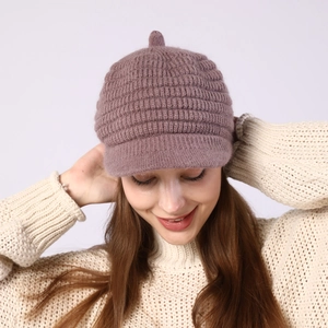 Close-up of lavender knit beret cap with thick textured weave and warm inner lining