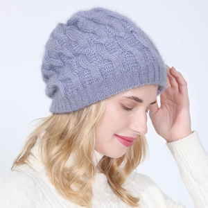 Detail of purple cable knit beanie with fluffy texture and subtle shimmering fibers
