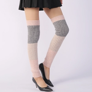 Detail of pink and grey striped knitted leg warmers with ribbed texture over the knee