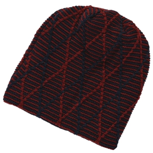 Detail of red and black knit beanie featuring a unique spider web diamond grid pattern
