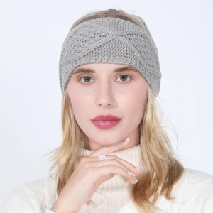 Close-up of grey cable-knit headband for women with detailed diamond pattern weave