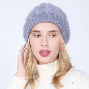 Detailed close-up of light purple knitted cable pattern hat with subtle gold silk thread