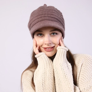 Detail of warm striped knit visor beanie with soft fleece lining in mauve pink color