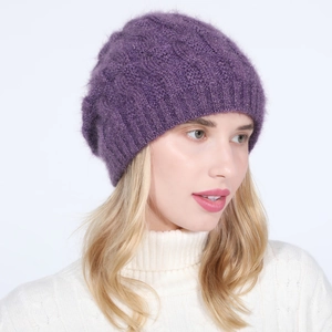 Detail of dark purple knit beanie with shimmering gold fibers and wavy texture