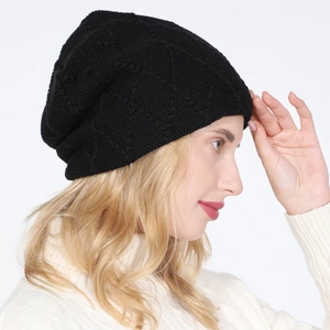 Close-up of black knitted beanie featuring thick diamond pattern and thermal lining