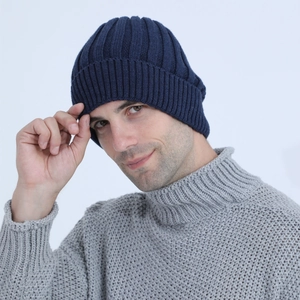 Detail of navy blue ribbed knit beanie with soft warm lining for winter season