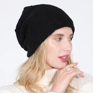 Close-up of black diamond knit beanie showing textured pattern and slouchy design