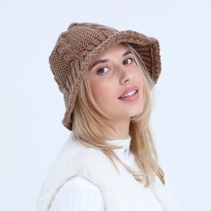 Detailed close-up of brown cable knit pattern and texture on wool bucket hat