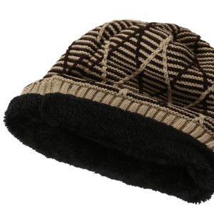 Detail of warm winter knit beanie showing thick black fleece lining and diamond grid pattern
