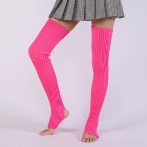Detail of neon pink ribbed knit leg warmers with stirrup design for ballet and yoga